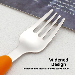 Close-up of baby fork with wide rounded stainless steel tips and orange grip handle