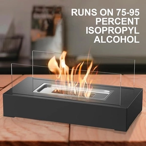 Close-up of rectangular tabletop ethanol fireplace with glass panels and real burning flames