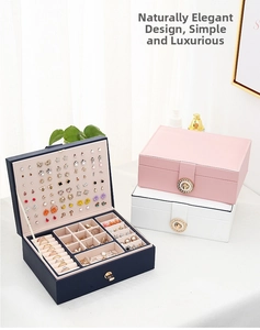 Detail view of double-layer leather jewelry box with earring plate and ring slots