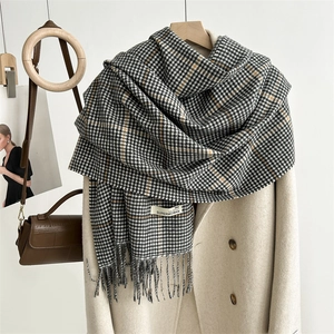 Classic houndstooth plaid scarf with soft cashmere feel and Superwoman label on a hanger