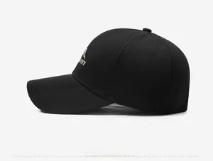 Side view of black baseball cap with mountain embroidery and reinforced stitched brim
