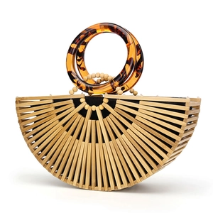 Handmade bamboo half-moon handbag with acrylic tortoiseshell handles for beach vacation