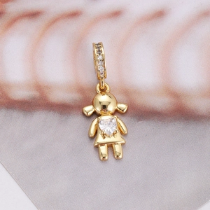 Macro view of gold girl pendant featuring a heart cubic zirconia and paved bail stones