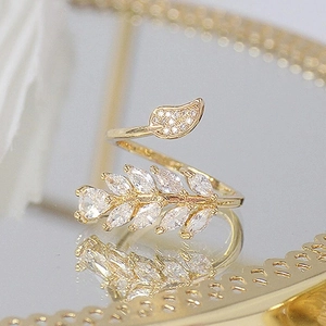 Sparkling zircon leaf open ring in gold finish with adjustable band for women