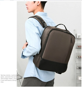 Business laptop backpack in brown and black contrast with padded shoulder straps