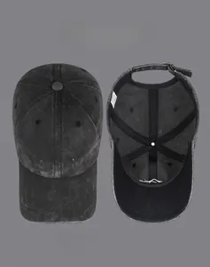 Detail of vintage washed baseball cap showing embroidered mountain and internal lining structure