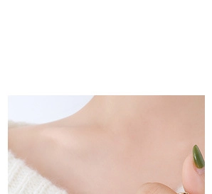 Close-up of the elegant oval zircon pendant necklace worn on a female model neck