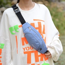 Blue waterproof sports waist bag shown on model for a compact outdoor running look