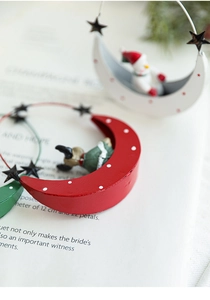 Artistic metal moon-shaped Christmas pendants featuring reindeer and snowman figures