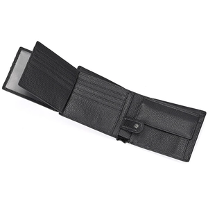 Detail view of black pebble leather wallet showing multi-card slots and coin pocket