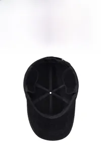 Detail view of winter baseball cap with plush lining and foldable ear flaps for warmth