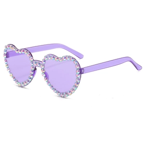 Detail of purple heart-shaped sunglasses with colorful rhinestones on a white background