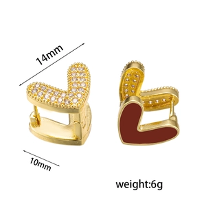 Double-sided heart hoop earrings with red enamel and white zircon stones in gold finish