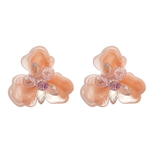 Pink resin flower hoop earrings with crystal core displayed on a white background