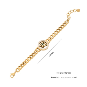 Detailed gold evil eye charm bracelet in stainless steel with measurement annotations