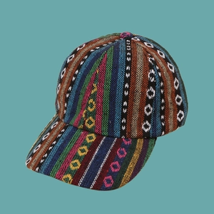 Detailed close-up of ethnic style woven baseball cap with colorful striped patterns
