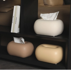 Boîtes à mouchoirs modernes en forme de galet dans les tons crème, marron et gingembre