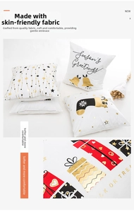 Detail of Christmas pillowcase showing festive gold foil printing and soft knit fabric texture