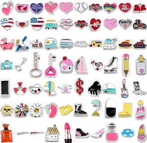 Flat lay of colorful enamel floating charms including hearts and letters for DIY jewelry