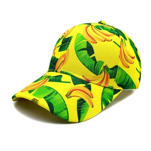 Close-up of tropical banana and green leaf print texture on a yellow baseball cap