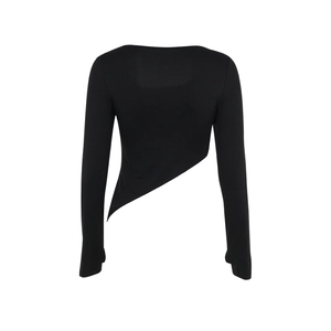 Detail view of the irregular asymmetrical hem on a black slim-fit long sleeve top