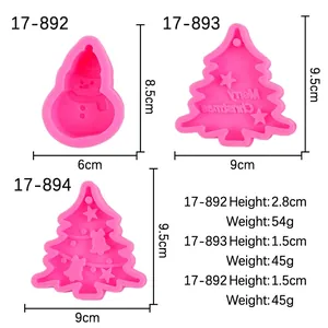 Pink Christmas silicone mold set featuring snowman and tree shapes for baking and crafts