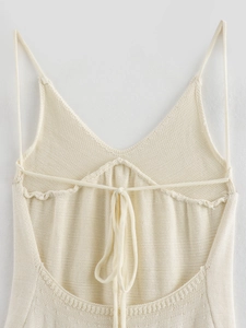 Women's cream knitted halter top with V-neckline and adjustable back lace-up detail