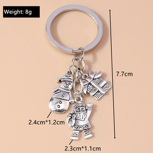 Detail view of silver Christmas keychain showing snowman and gift charms with dimensions
