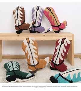 Group of colorful tufted boot-shaped pillows featuring vibrant flame patterns and soft texture