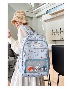 Blue student backpack with cartoon dog prints and front transparent display pocket