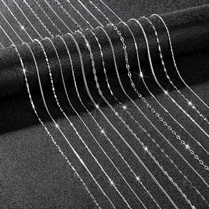 Detail view of various silver chain necklaces including box, snake and link styles