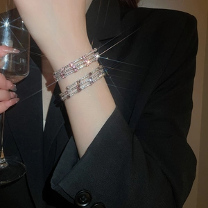 Close-up of three-layer layered bracelet with pink and white cubic zirconia crystals