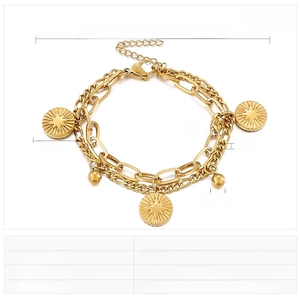 Detail of double-layer gold chain with star coin charms and paperclip link pattern
