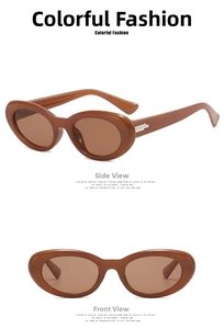 Detail view showing oval amber sunglasses with thick frame and silver metal temple accents