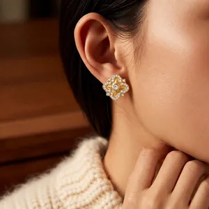 Gold plated geometric flower stud earrings with sparkling white zircon stones for women