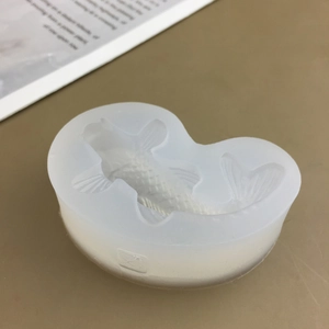 Detailed macro view of a 3D koi fish silicone mold for chocolate and cake decorating