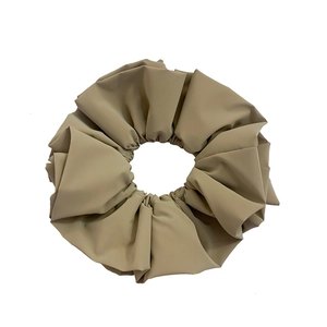 Elegant beige faux leather oversized scrunchie with soft ruffled pleats for updos
