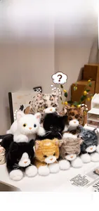 Detailed macro view showing eight realistic plush kittens with diverse fur patterns and textures