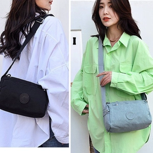 Multi-pocket nylon crossbody bag for women in black and light blue options