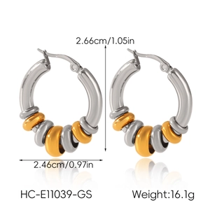 Detailed view of bicolor stainless steel earrings with gold and silver hoops and measurements