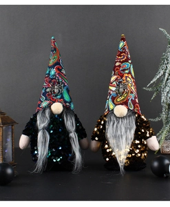Close-up of Halloween faceless gnomes with sequins and paisley hats for festive decor