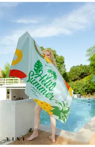 Outdoor model show of absorbent quick-dry microfiber beach towel with palm leaf pattern