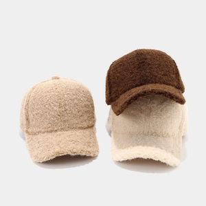 Three plush bouclé baseball caps in dark coffee, beige, and oatmeal autumn colors