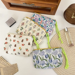Set of Korean-style floral makeup pouches with vibrant rope handles for travel storage
