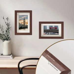 Minimalist wood photo frame set on a white wall with scenery photos and rustic desk decor