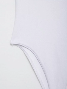 Detail of the high-quality stitching and white knit fabric on the bodysuit leg opening