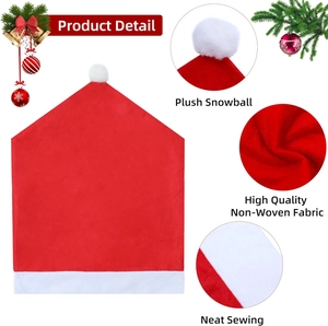 Red Christmas hat chair covers in non-woven fabric with white plush balls for festive dining decor