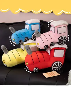 Detailed group shot of plush toy trains in blue, pink, yellow and red soft fabric