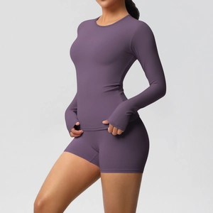 Detail of deep purple yoga set showing thumb holes and high-waisted fitness shorts
