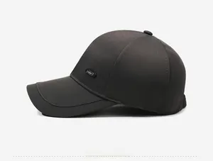 Detail view of quick-dry fabric texture and SPORT emblem on dark casual baseball cap
